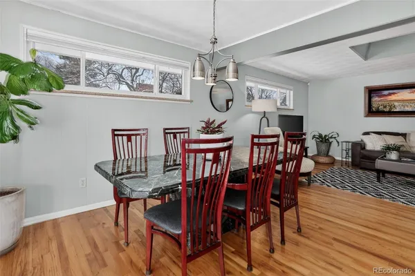 a kitchen with stainless steel appliances granite countertop wooden cabinets a stove top oven a sink and dishwasher