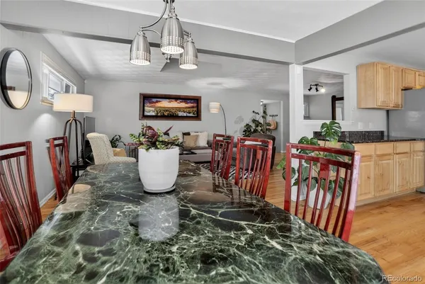 a kitchen with stainless steel appliances granite countertop a refrigerator sink and cabinets