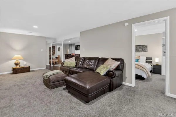 a bedroom with a bed and a lamp