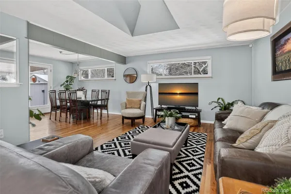 a living room with furniture and a rug
