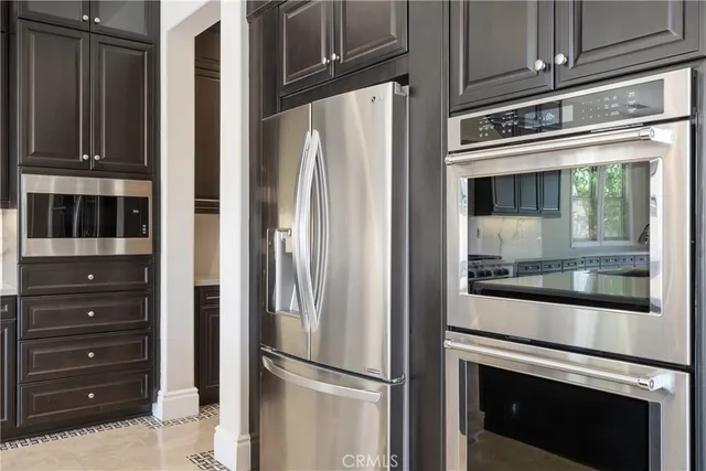 a view of room with wooden cabinets