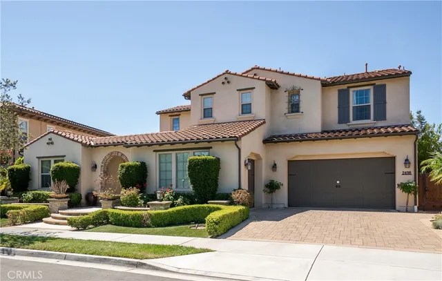 a view of a house with a yard and plants