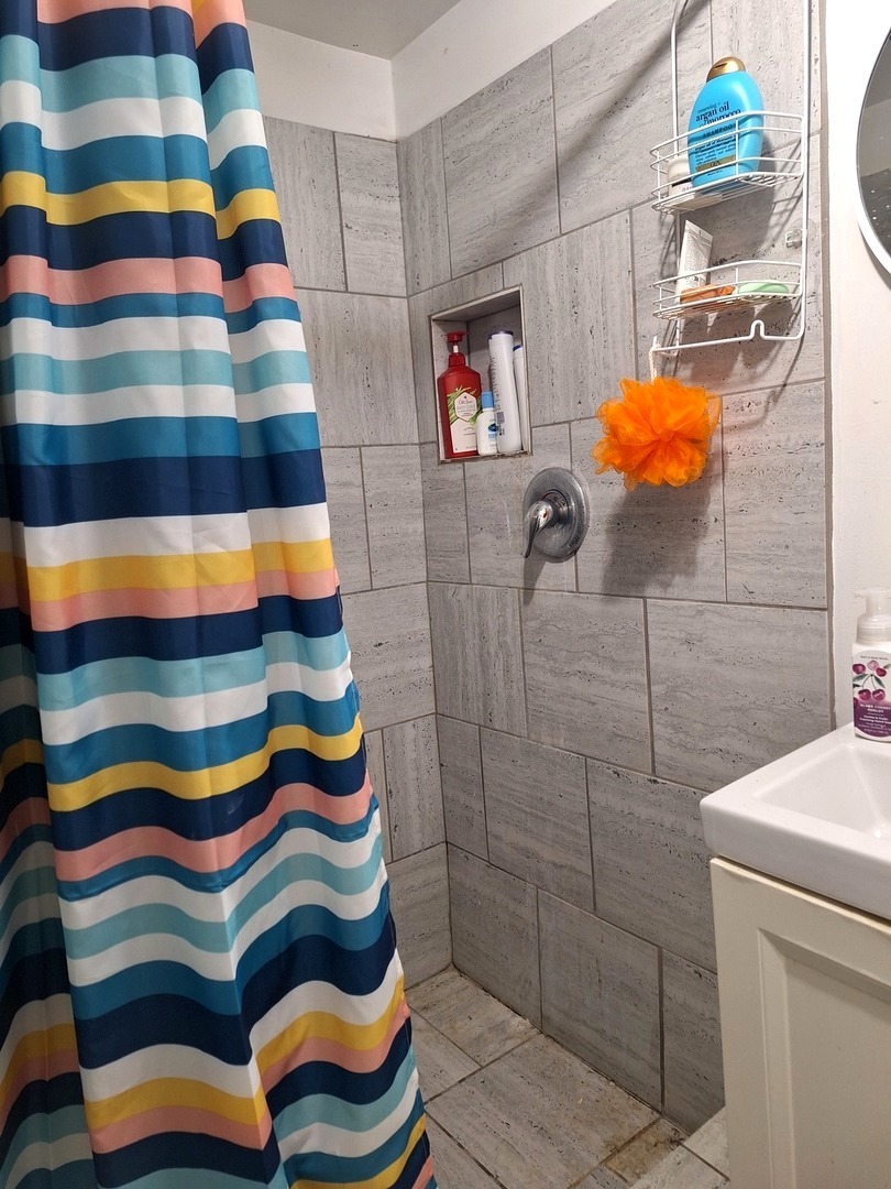 1505 North Otter Creek Road Streator, IL 61364 - Photo 24 of 40 a bathroom with a toilet and shower curtain
