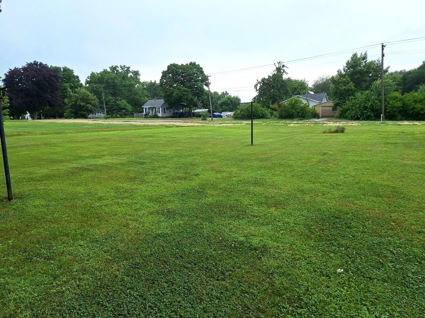 1505 North Otter Creek Road Streator, IL 61364 - Photo 35 of 40 a view of a grassy field with trees in the background