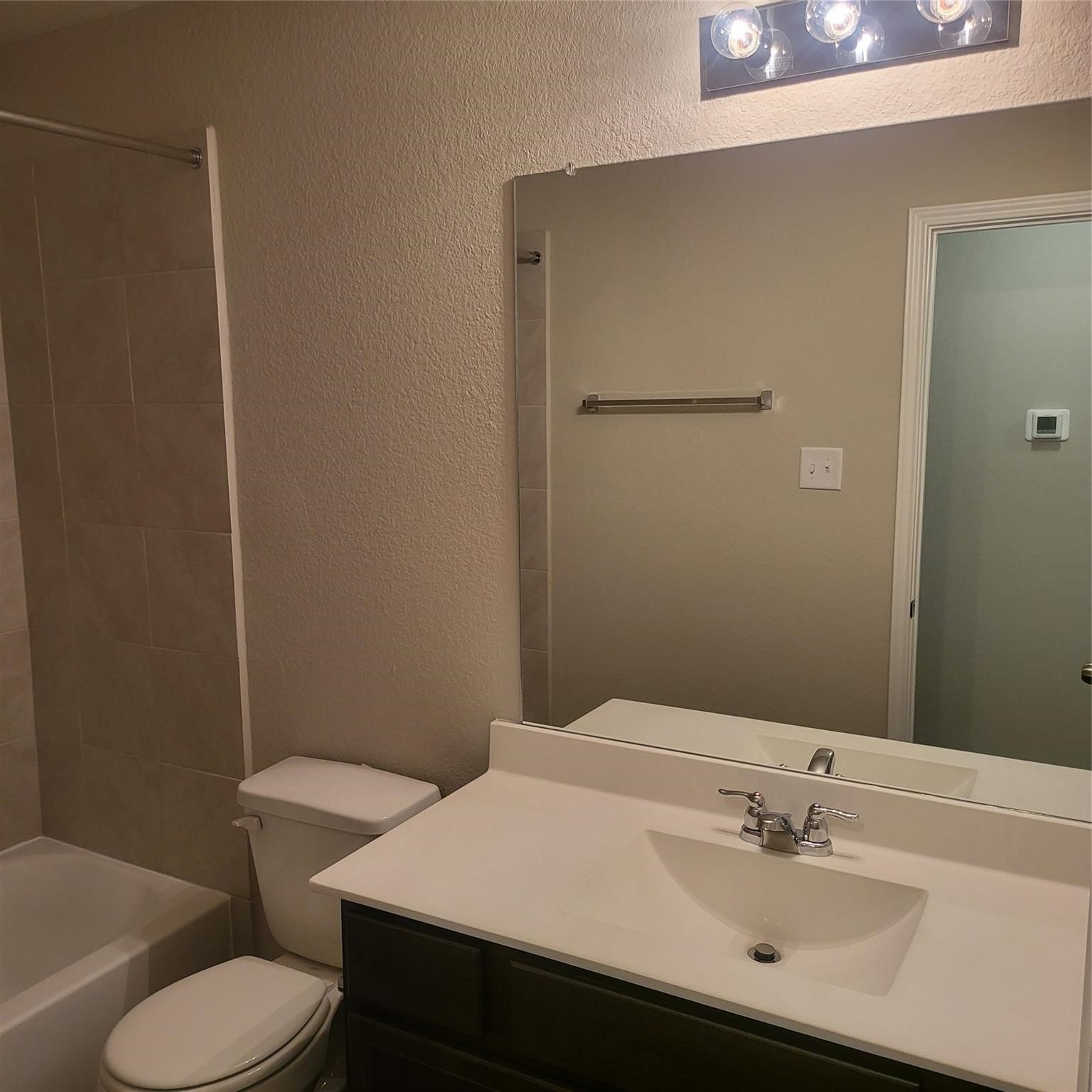 22114 Imperious Park Way Houston, TX 77073 - Photo 12 of 16 a bathroom with a sink toilet and a mirror