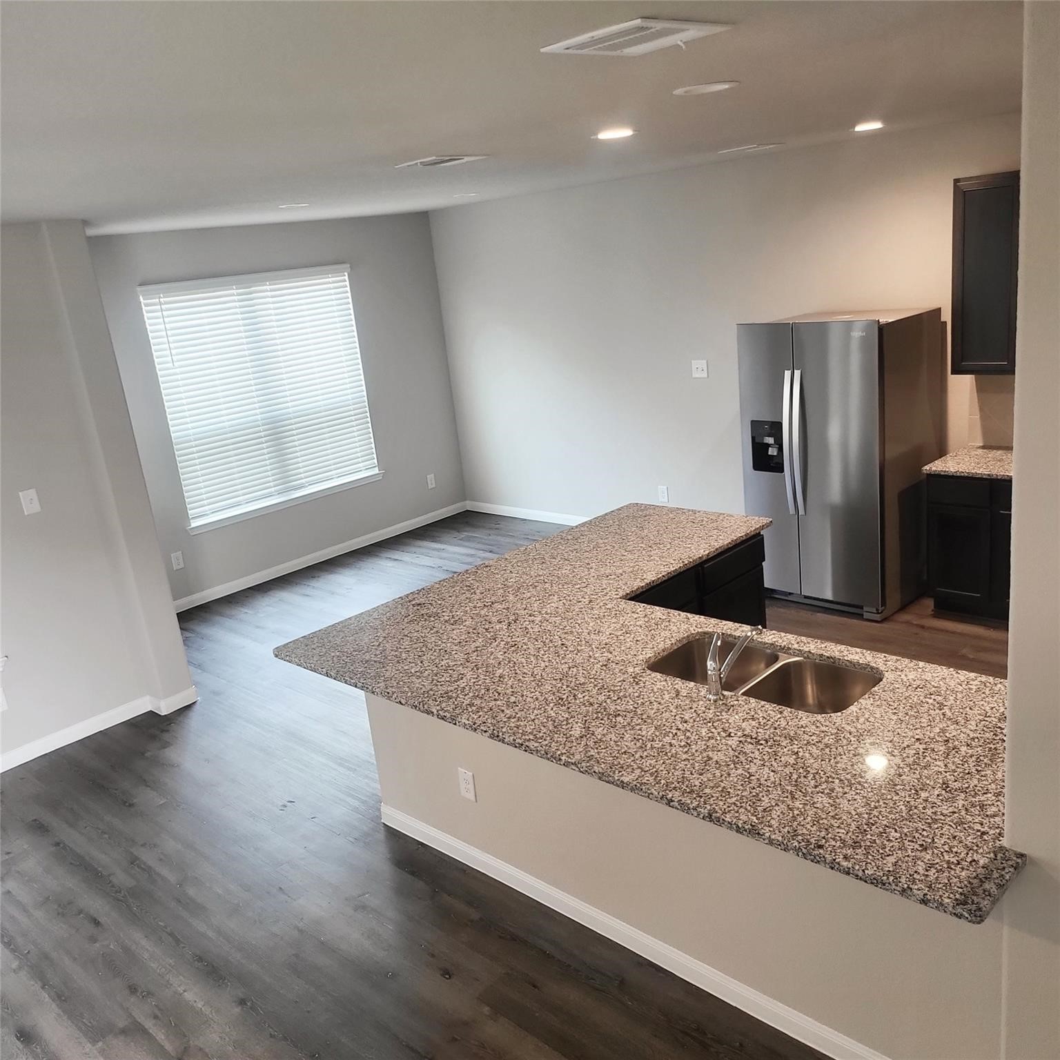 22114 Imperious Park Way Houston, TX 77073 - Photo 5 of 16 a kitchen with kitchen island granite countertop a sink and a oven