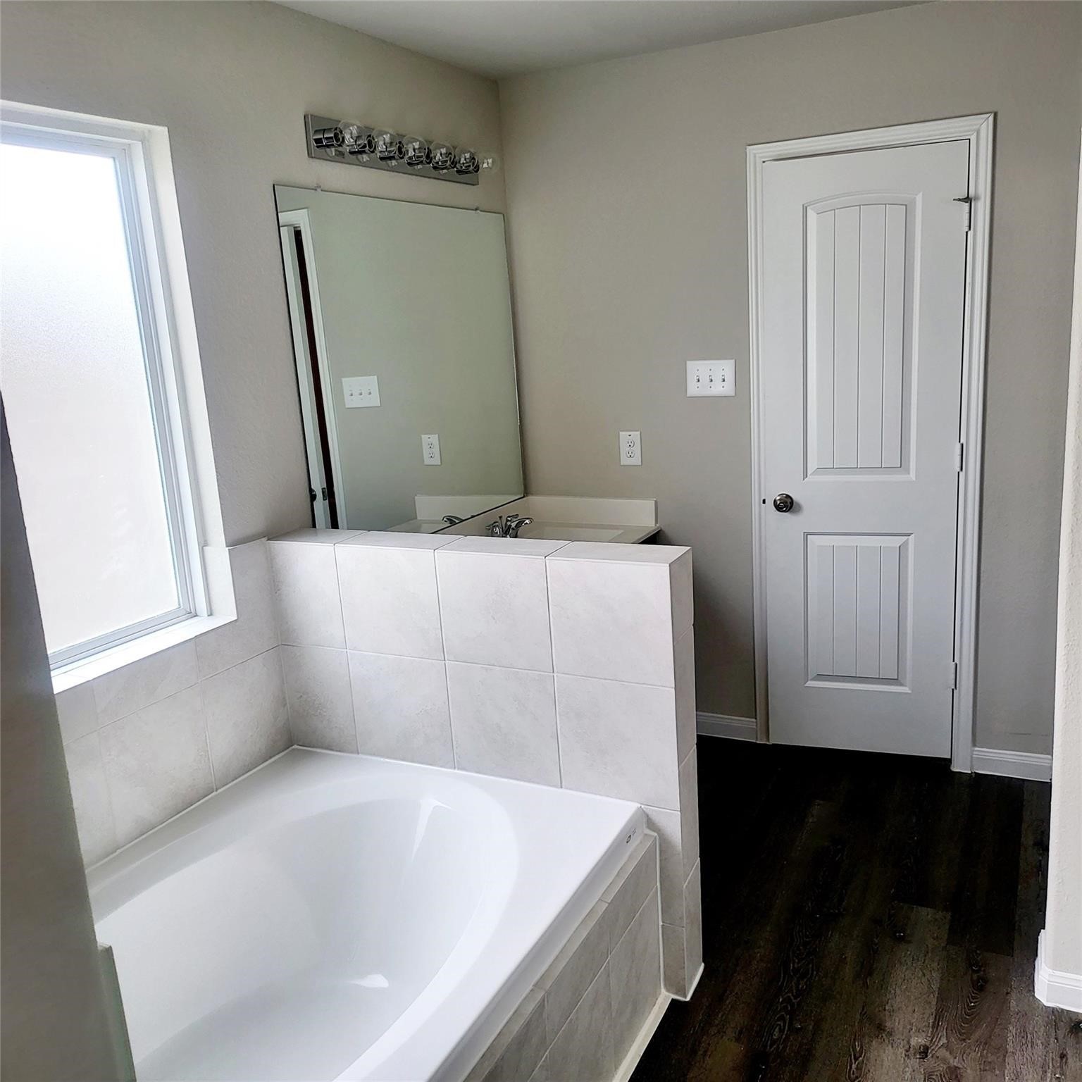 22114 Imperious Park Way Houston, TX 77073 - Photo 10 of 16 a bathroom with a bathtub and a sink