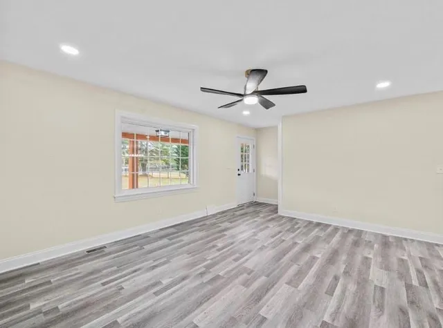 a view of an empty room with a window