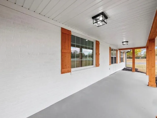 a view of kitchen with kitchen island microwave and stove