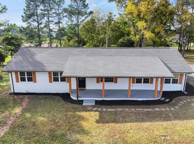 front view of a house with a yard