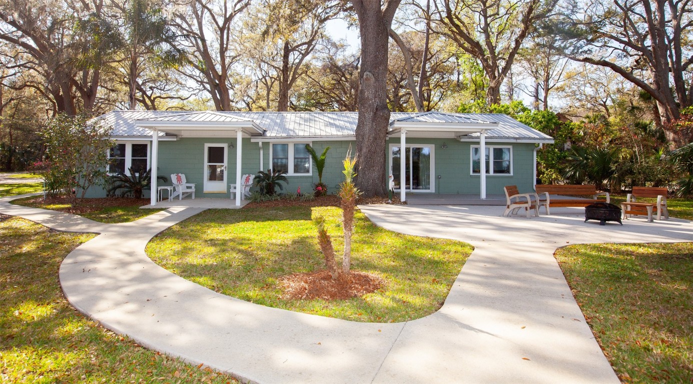 96153 Noeta Place Yulee, FL 32097 - Photo 1 of 24 a view of a swimming pool with a patio