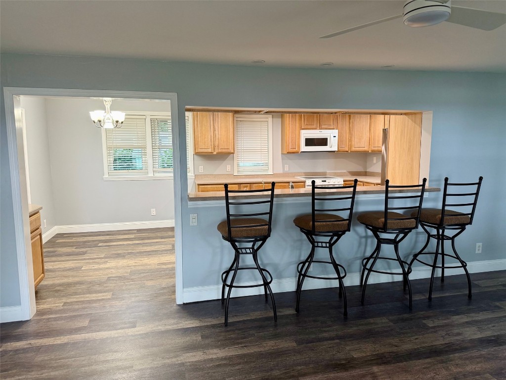 96153 Noeta Place Yulee, FL 32097 - Photo 11 of 24 a view of a dining room with furniture and wooden floor