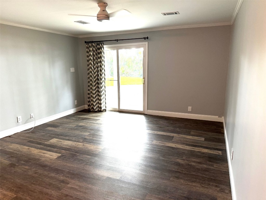 96153 Noeta Place Yulee, FL 32097 - Photo 12 of 24 an empty room with wooden floor and windows