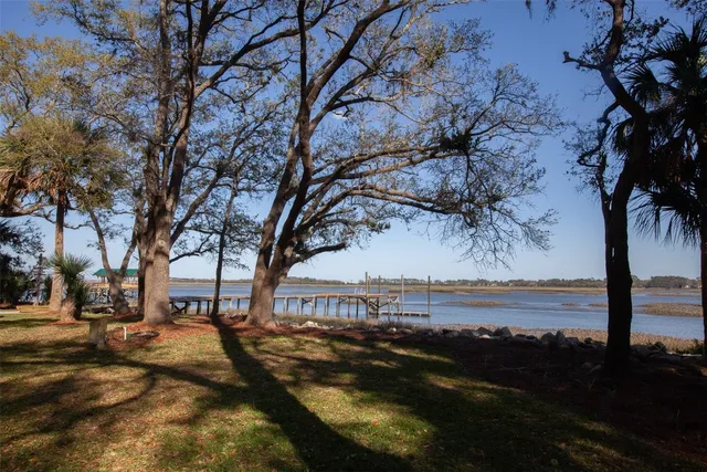 a view of lake with a yard