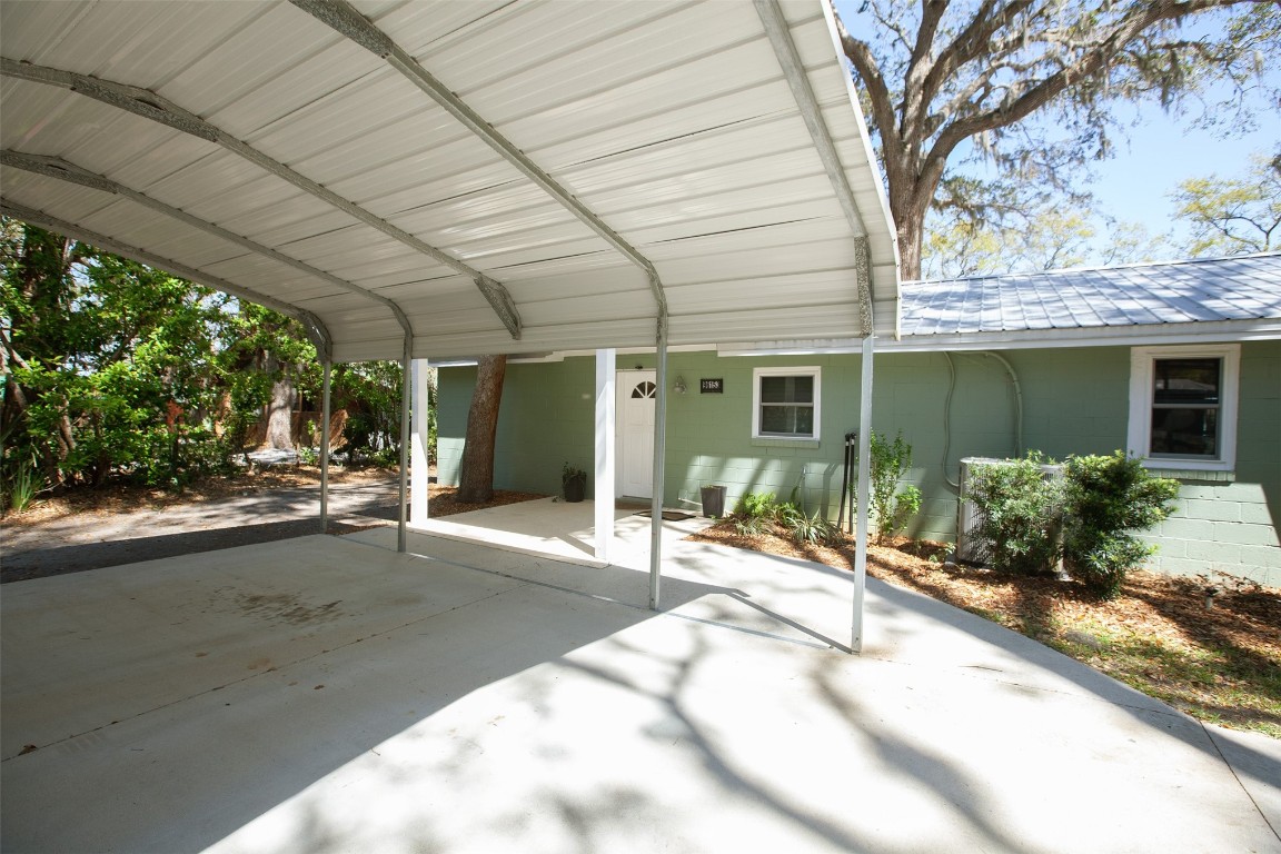 96153 Noeta Place Yulee, FL 32097 - Photo 21 of 24 a view of a house with backyard and sitting area