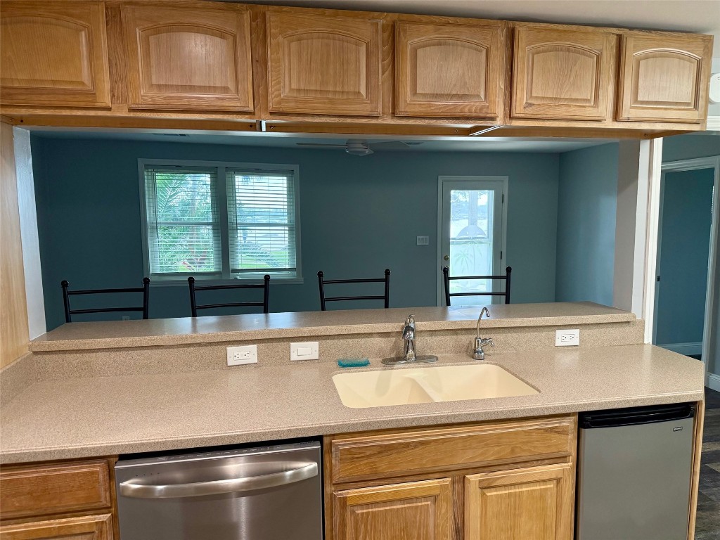 96153 Noeta Place Yulee, FL 32097 - Photo 9 of 24 a sink with cabinets and washer