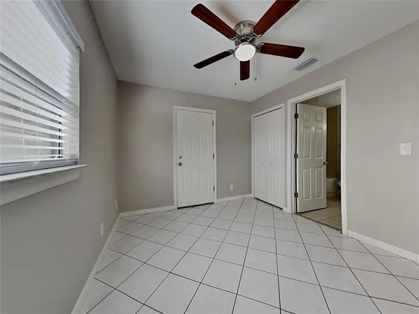 a view of an empty room with a window