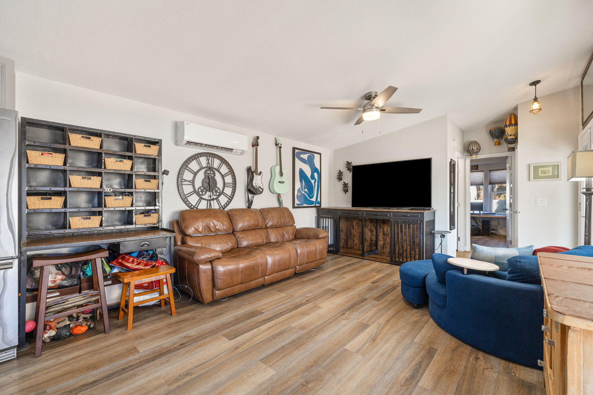 47800 Madison Street, Unit 79 Indio, CA 92201 - Photo 13 of 31 a living room with furniture and a flat screen tv