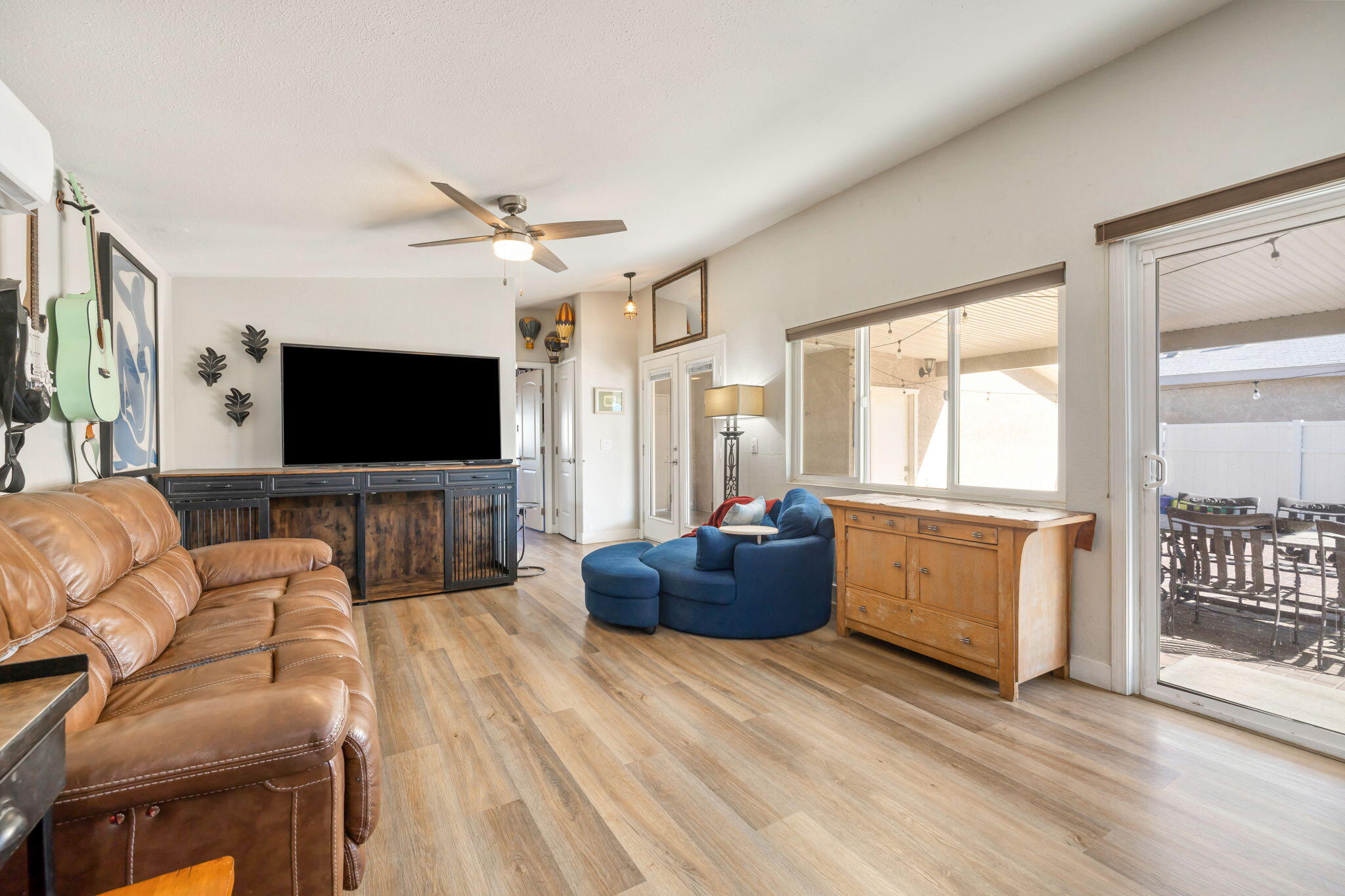 47800 Madison Street, Unit 79 Indio, CA 92201 - Photo 14 of 31 a living room with furniture and a flat screen tv