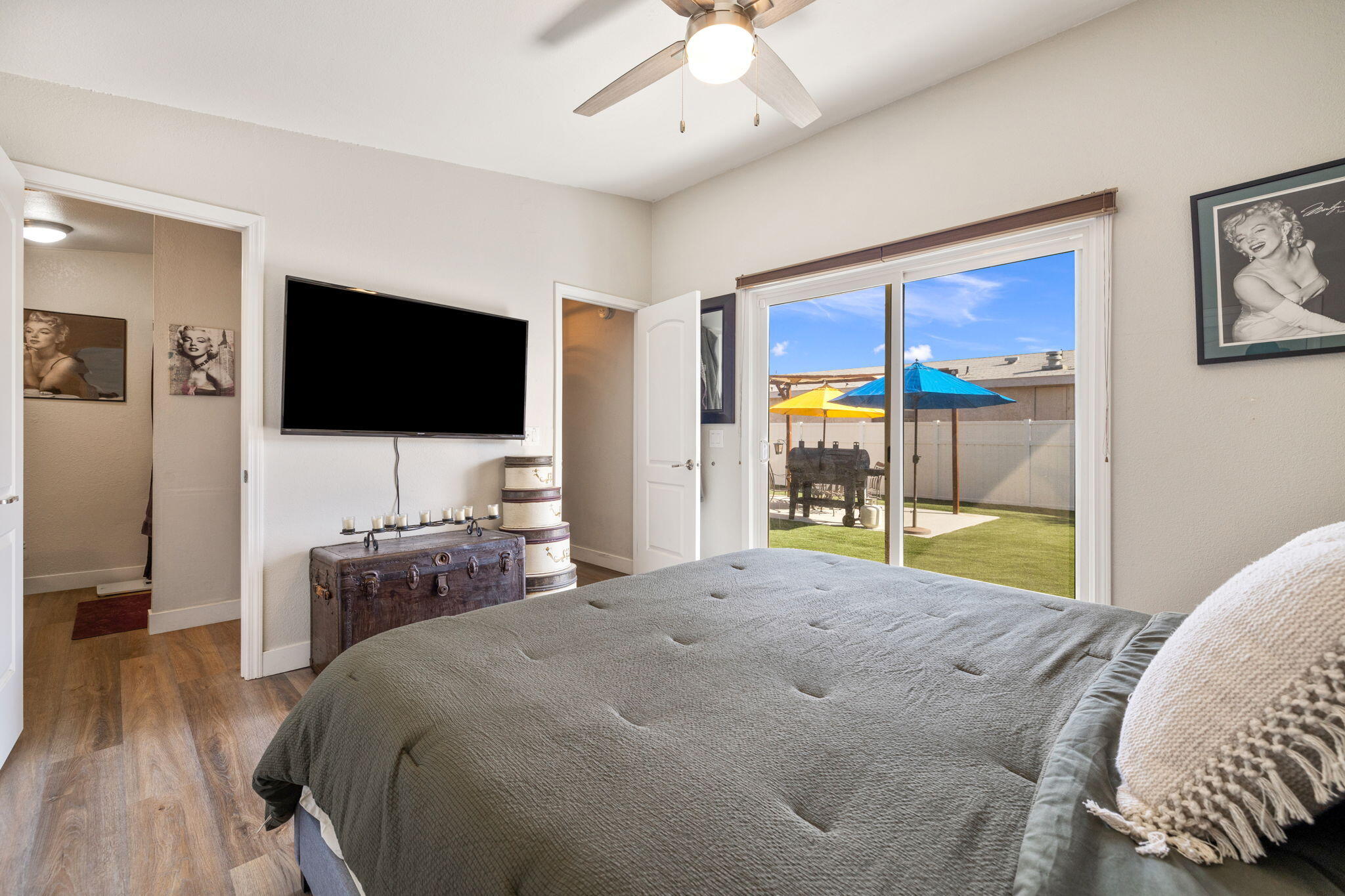 47800 Madison Street, Unit 79 Indio, CA 92201 - Photo 23 of 31 a bedroom with a bed and a flat screen tv