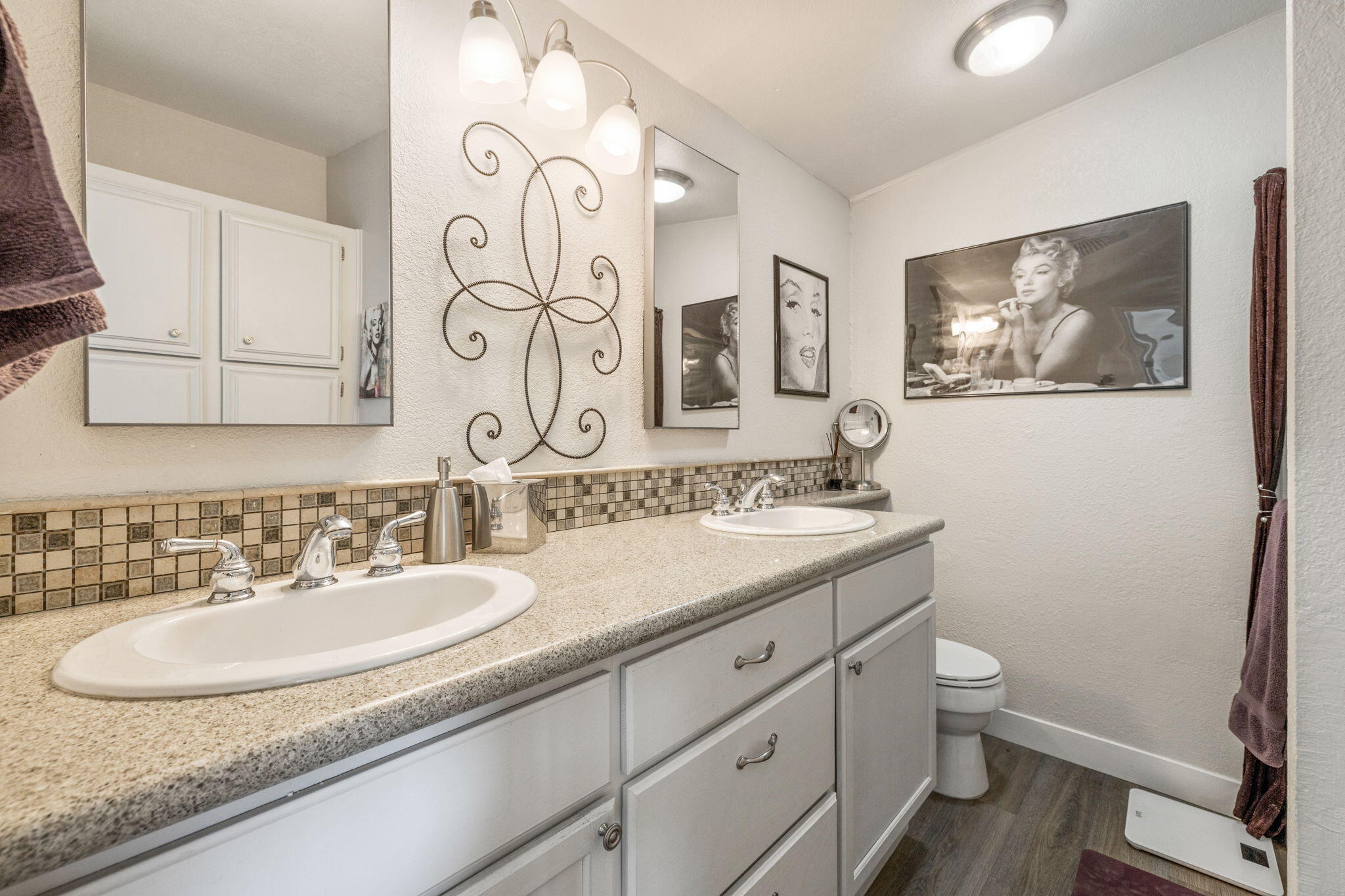 47800 Madison Street, Unit 79 Indio, CA 92201 - Photo 24 of 31 a bathroom with a granite countertop sink mirror and toilet