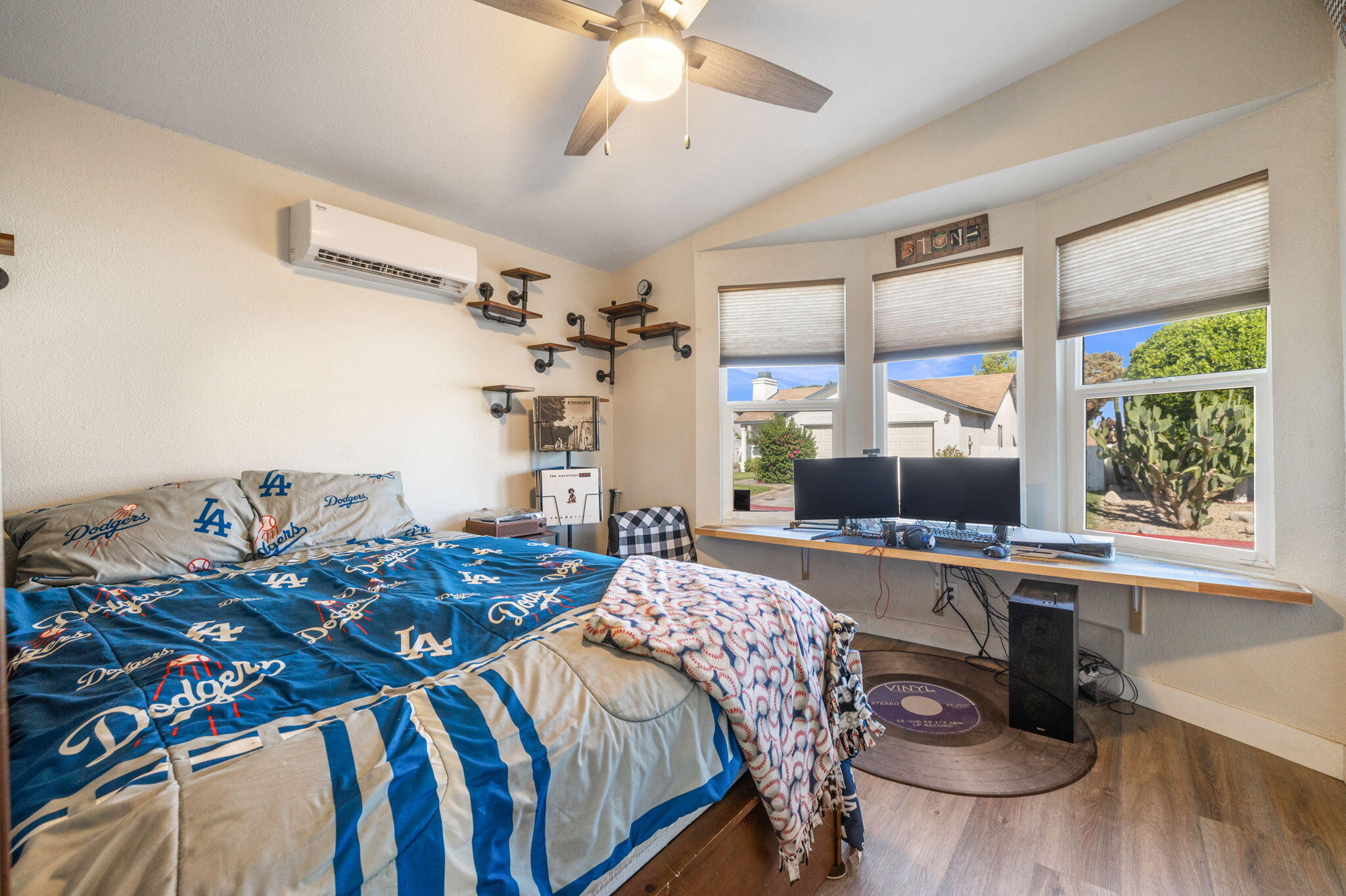 47800 Madison Street, Unit 79 Indio, CA 92201 - Photo 27 of 31 a bedroom that has a bed and a table in it