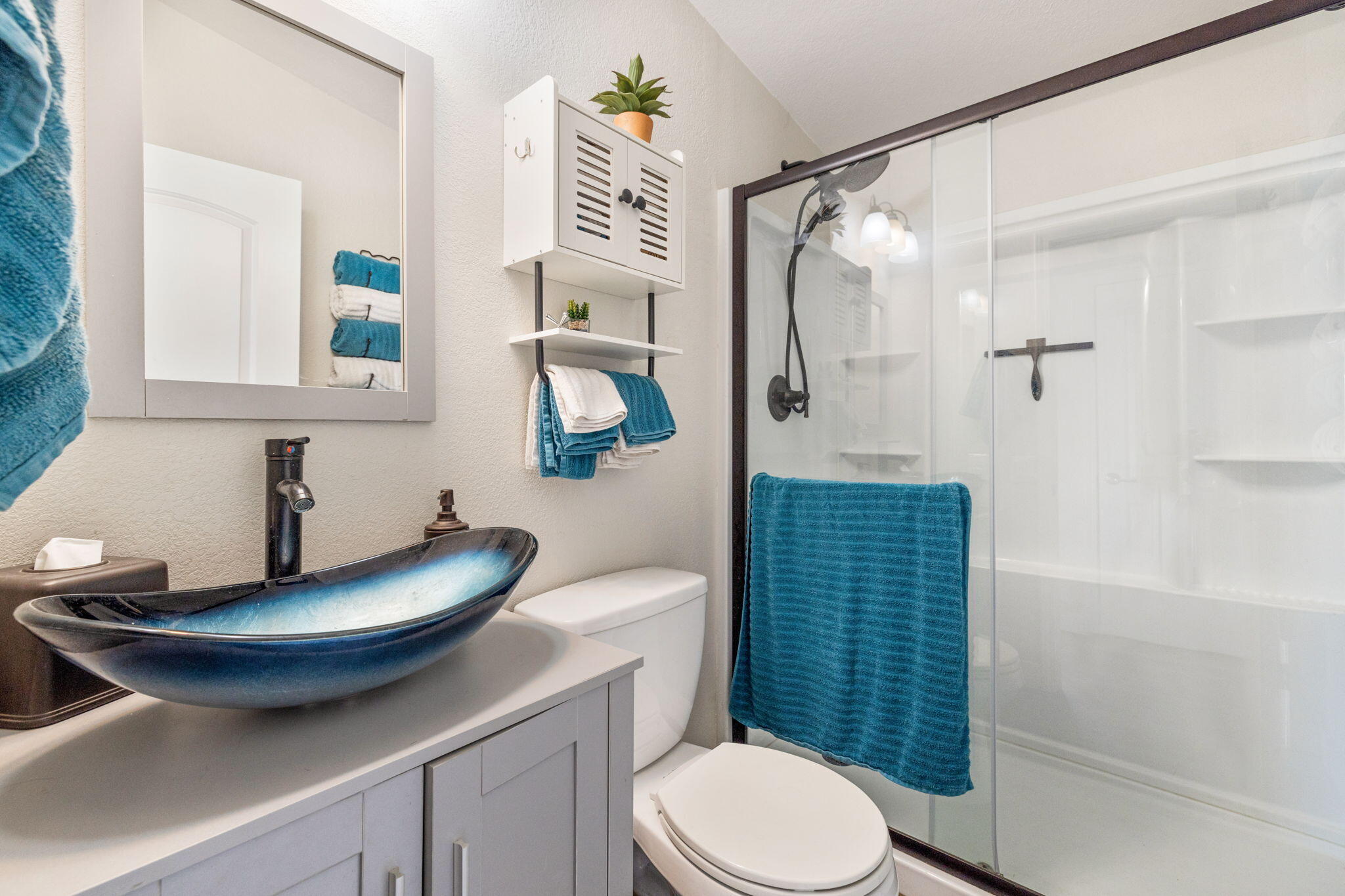 47800 Madison Street, Unit 79 Indio, CA 92201 - Photo 29 of 31 a bathroom with a sink a toilet and shower