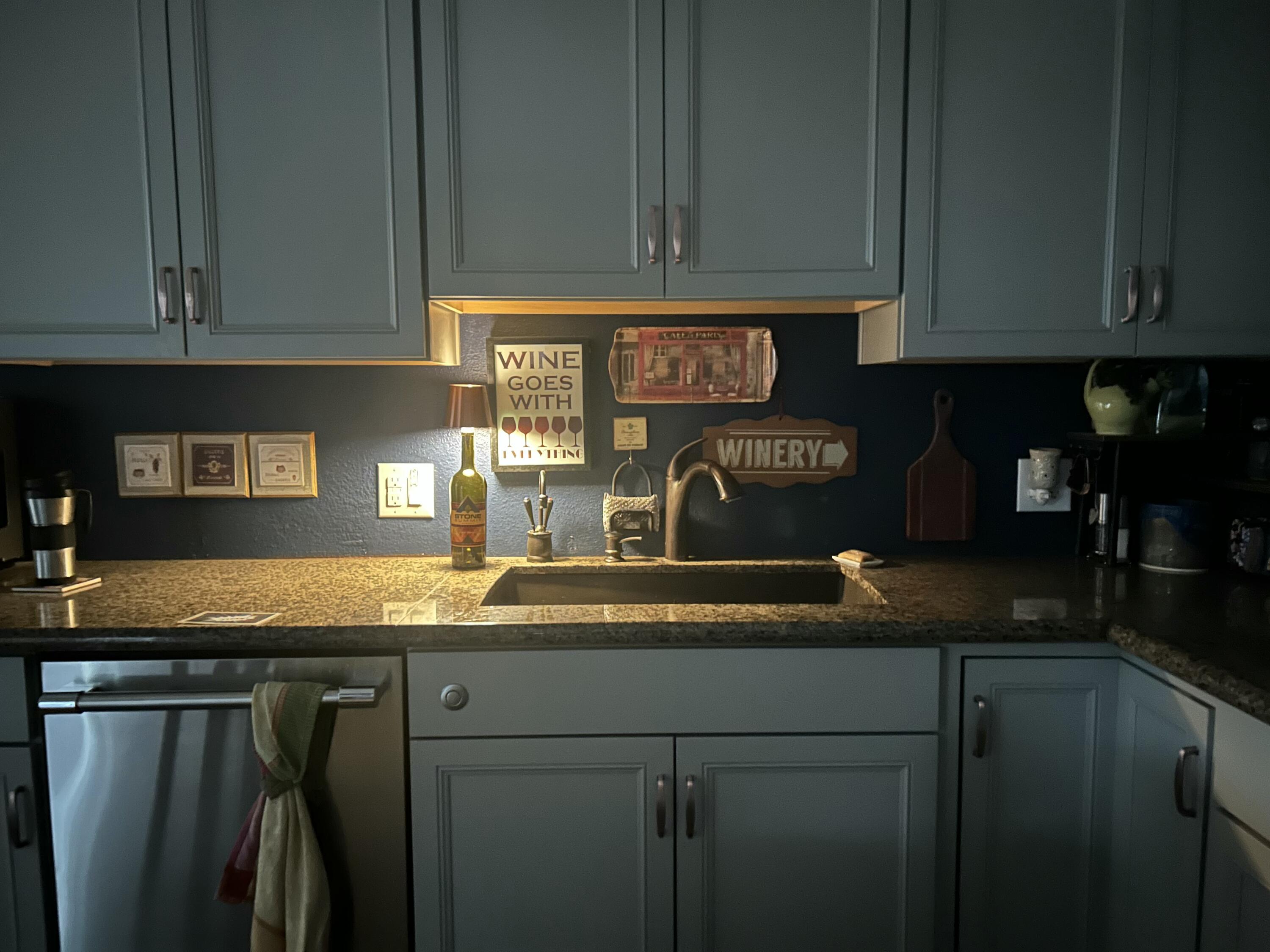47800 Madison Street, Unit 79 Indio, CA 92201 - Photo 31 of 31 a kitchen with granite countertop cabinets and a sink