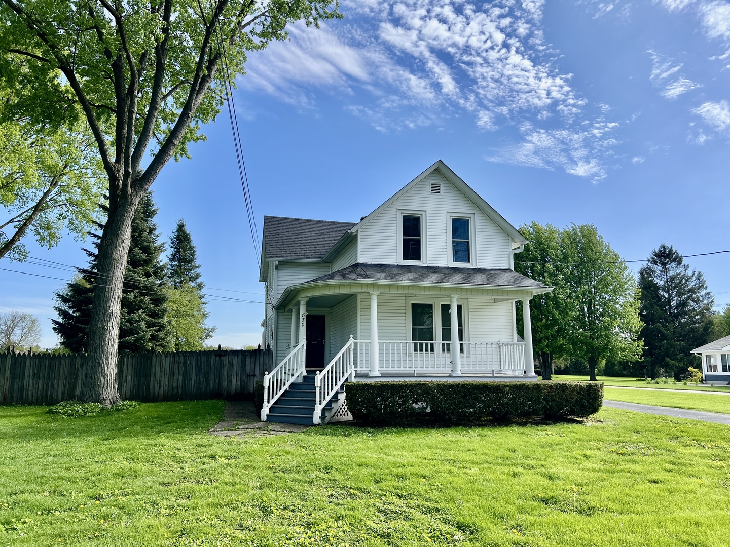 830 Garfield Avenue, Unit UP Batavia, IL 60510 - Photo 12 of 12 a front view of a house with a yard