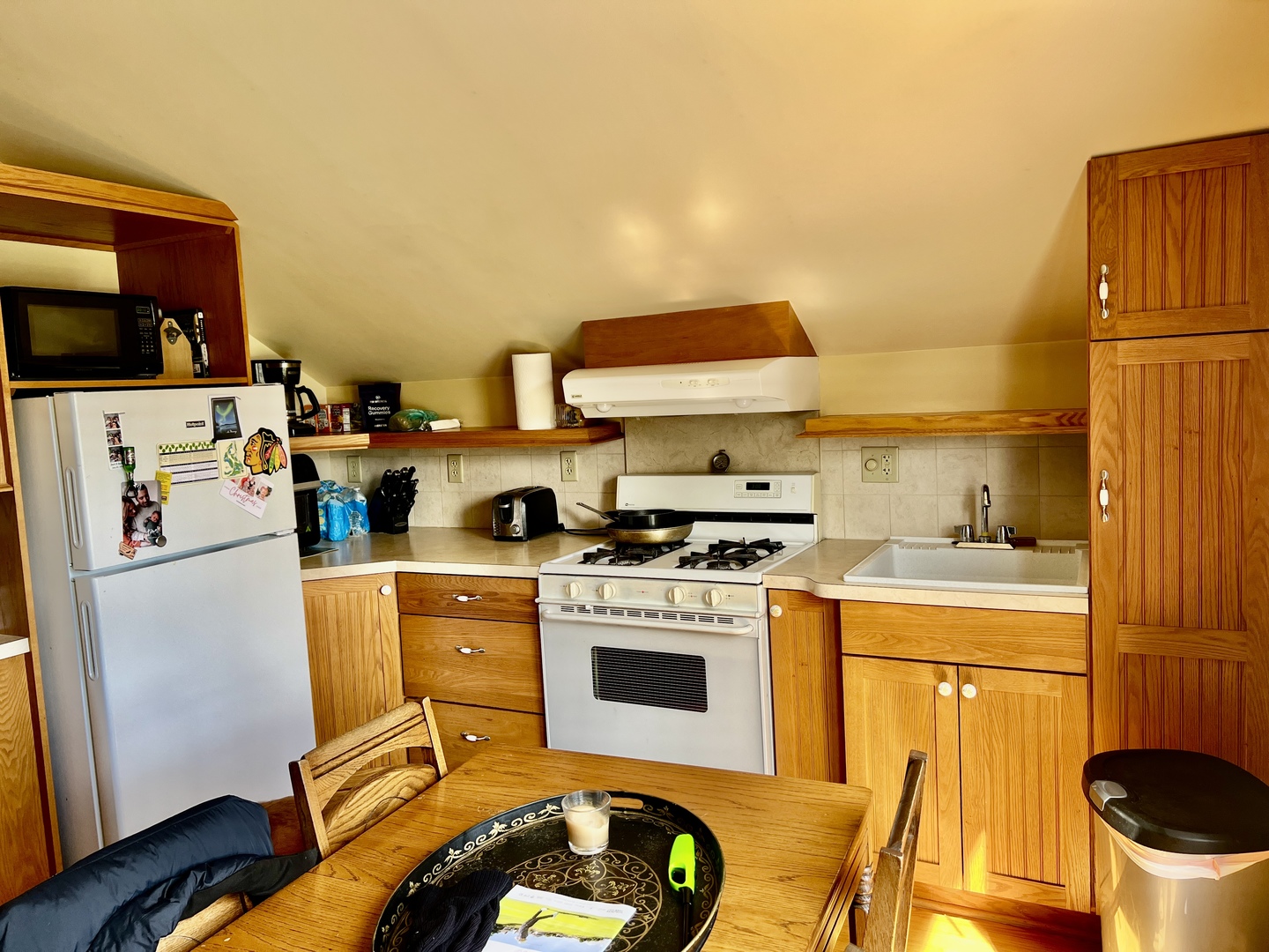 830 Garfield Avenue, Unit UP Batavia, IL 60510 - Photo 7 of 12 a kitchen with a stove a refrigerator and a stove top oven