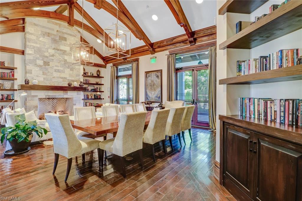 17818 Modena Road Miromar Lakes, FL 33913 - Photo 12 of 21 a view of a dining room with furniture window and wooden floor