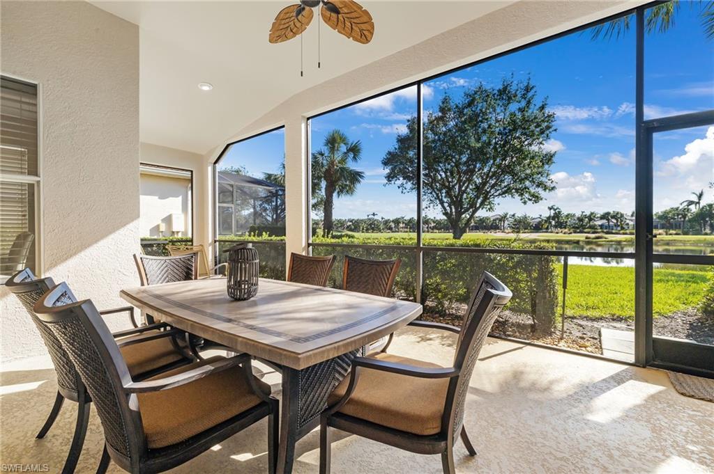 17818 Modena Road Miromar Lakes, FL 33913 - Photo 2 of 21 a view of a dining room with furniture large windows and wooden floor
