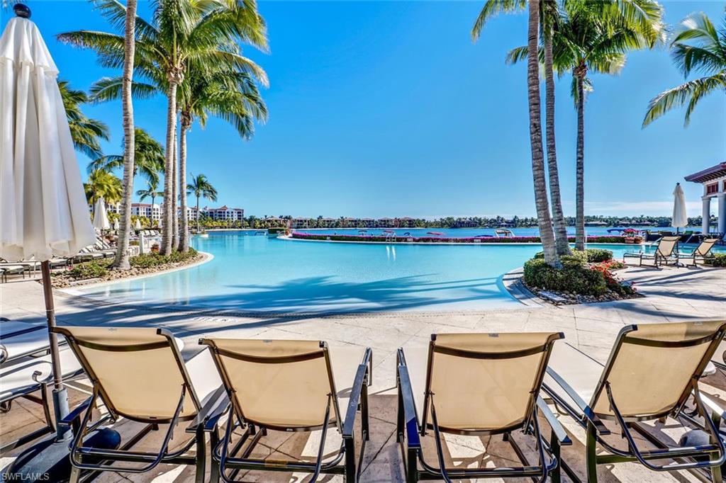 17818 Modena Road Miromar Lakes, FL 33913 - Photo 9 of 21 a view of a chairs and table in patio with a lake view