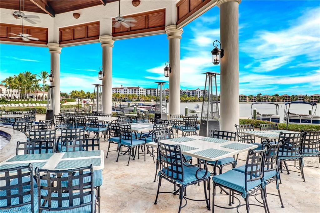 17818 Modena Road Miromar Lakes, FL 33913 - Photo 10 of 21 a view of a patio with a table and chairs