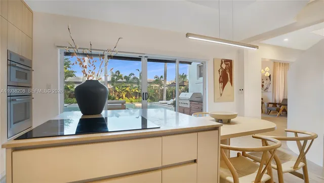 a living room with furniture a rug and a window