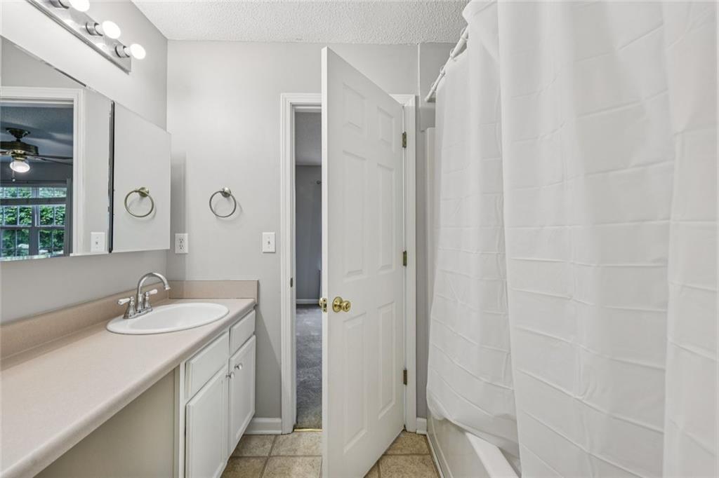 6812 Gallant Circle Southeast, Unit 1 Mableton, GA 30126 - Photo 14 of 24 a bathroom with a sink and a mirror