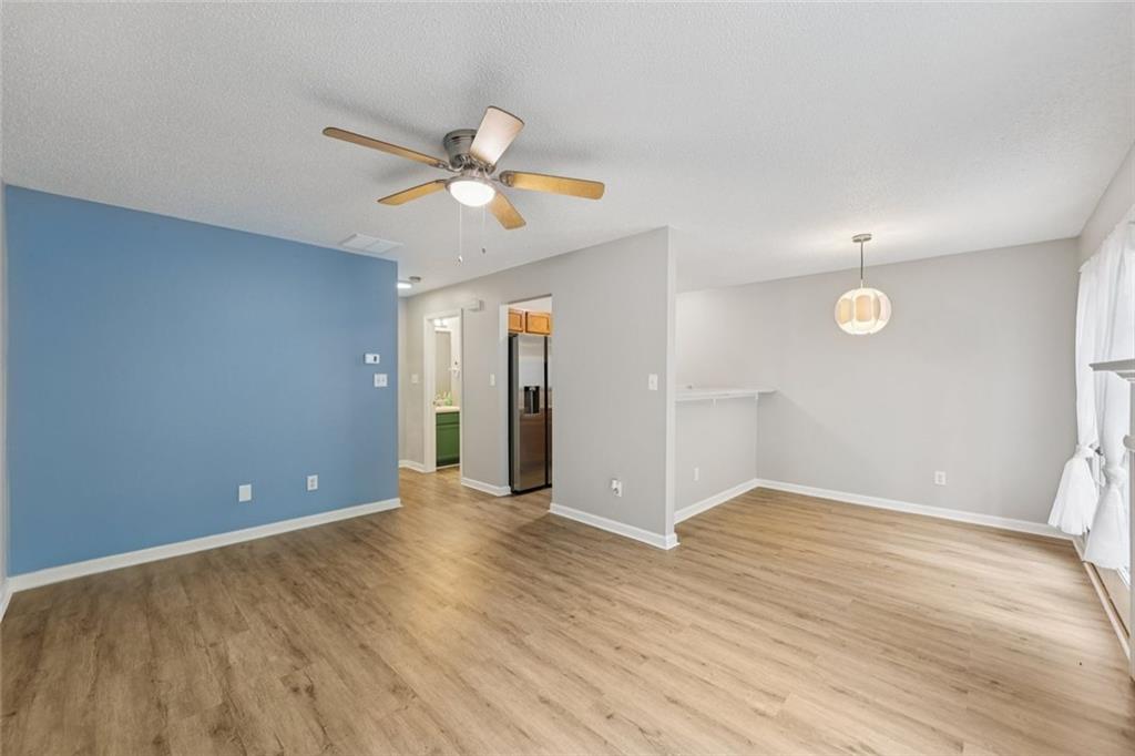 6812 Gallant Circle Southeast, Unit 1 Mableton, GA 30126 - Photo 5 of 24 wooden floor in an empty room with a window