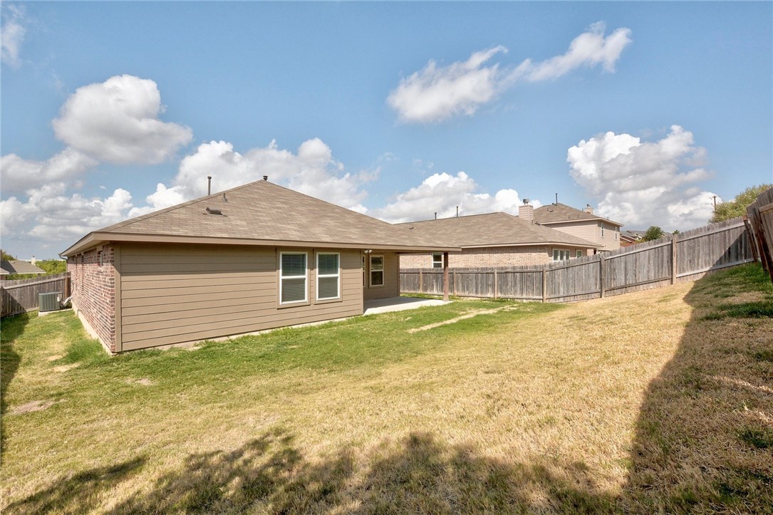 3621 Rams Horn Way Round Rock, TX 78665 - Photo 23 of 24 a front view of a house with a yard and garage