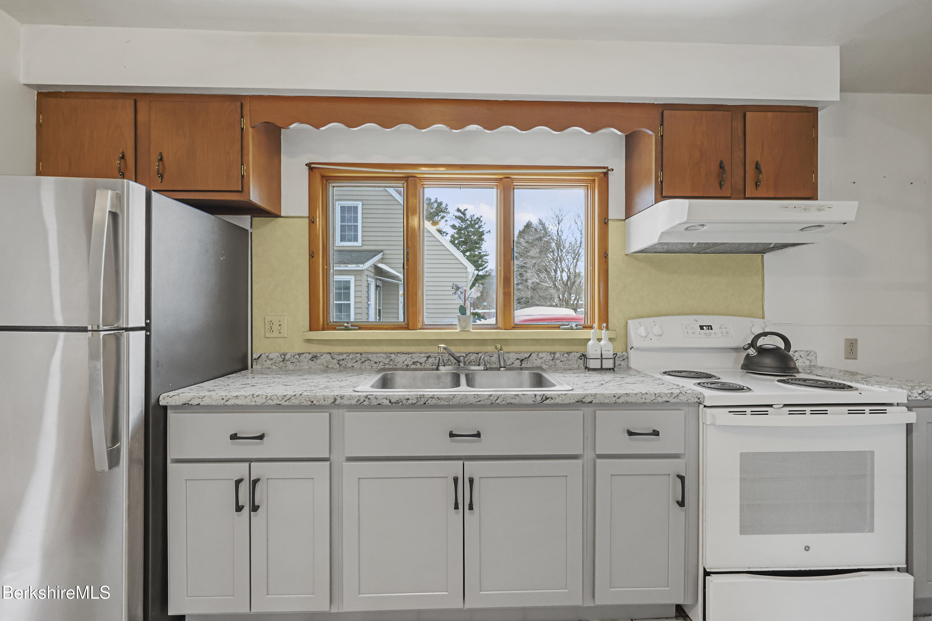20 Crystal Street Pittsfield, MA 01201 - Photo 12 of 29 a kitchen with a sink stove and refrigerator