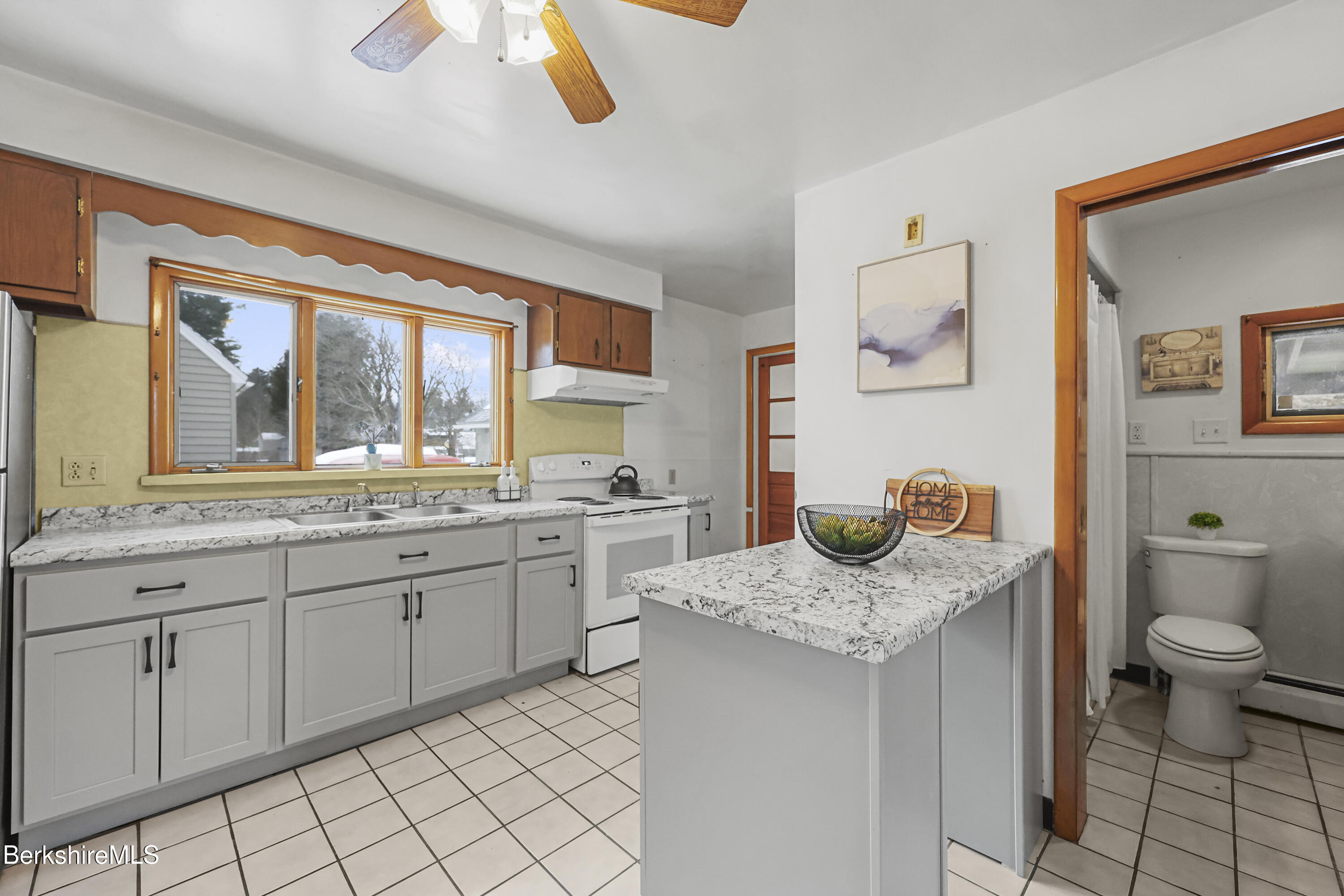 20 Crystal Street Pittsfield, MA 01201 - Photo 13 of 29 a bathroom with a granite countertop sink and a toilet