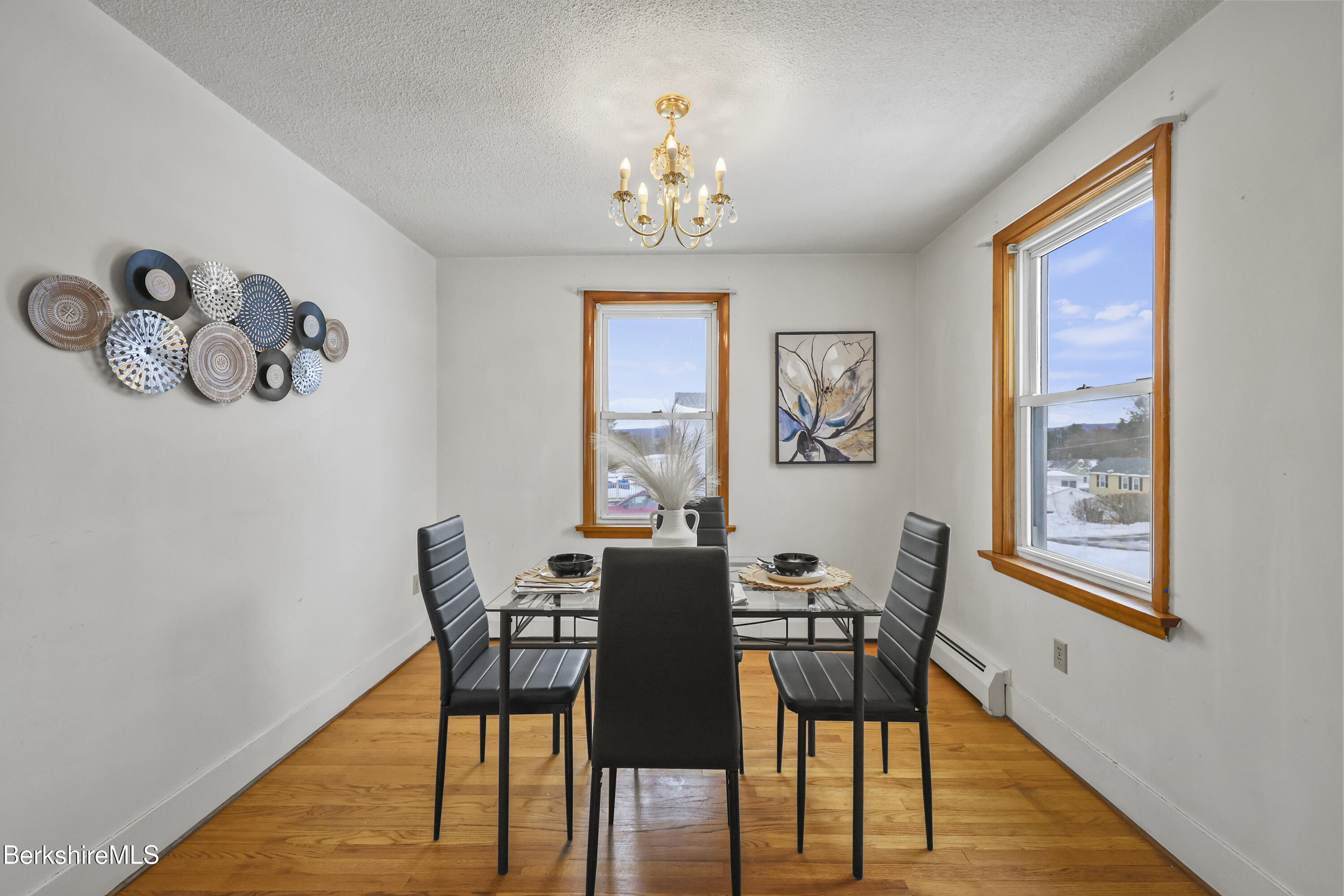 20 Crystal Street Pittsfield, MA 01201 - Photo 19 of 29 a view of a dining room with furniture a chandelier and wooden floor