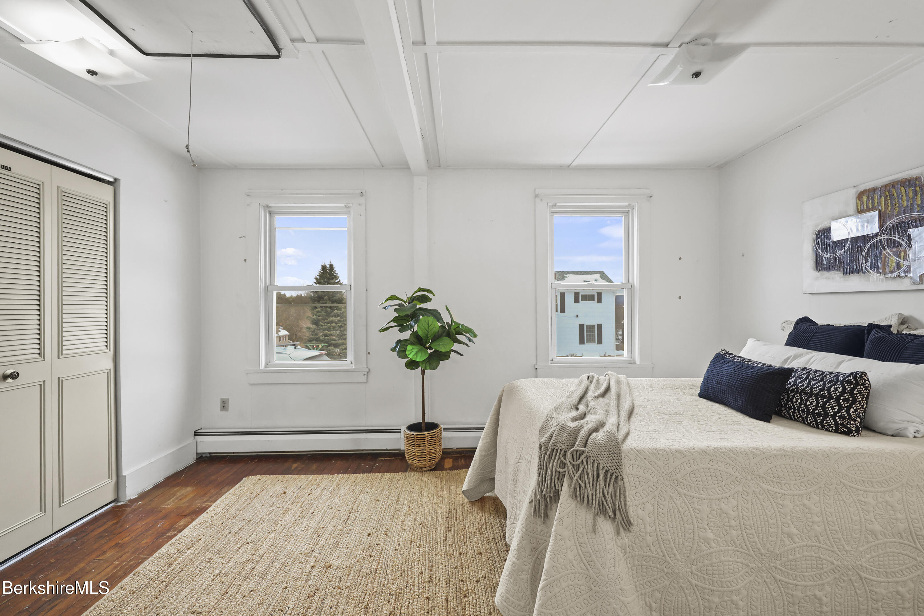 20 Crystal Street Pittsfield, MA 01201 - Photo 20 of 29 a bedroom with a bed and a chair