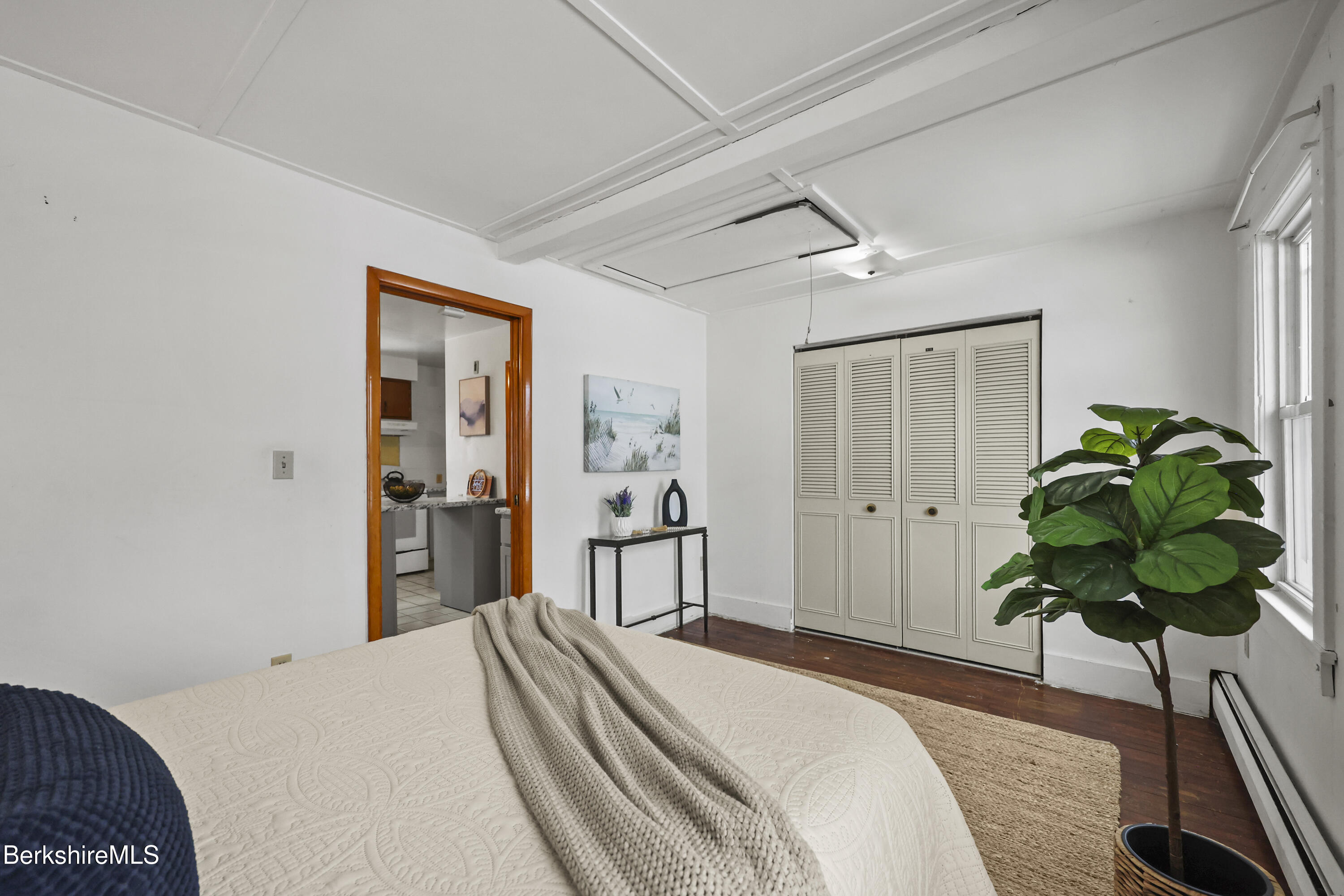 20 Crystal Street Pittsfield, MA 01201 - Photo 22 of 29 a bedroom with a bed and a potted plant