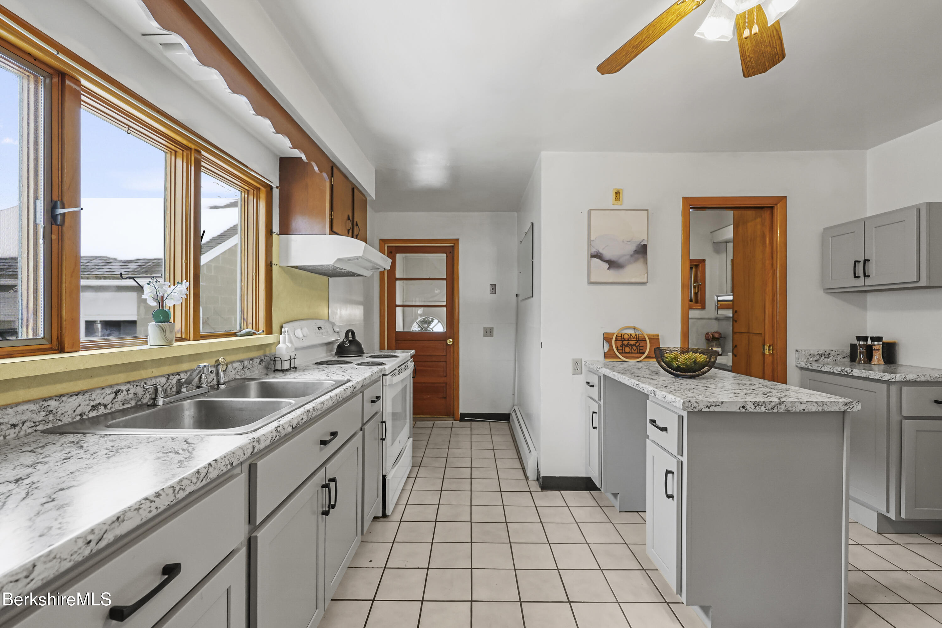 20 Crystal Street Pittsfield, MA 01201 - Photo 10 of 29 a kitchen with a sink stove and cabinets
