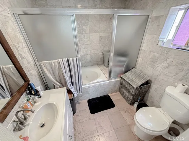 a bathroom with a sink a mirror and a bathtub