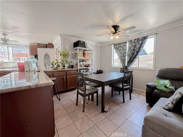 a bedroom with furniture and a flat screen tv