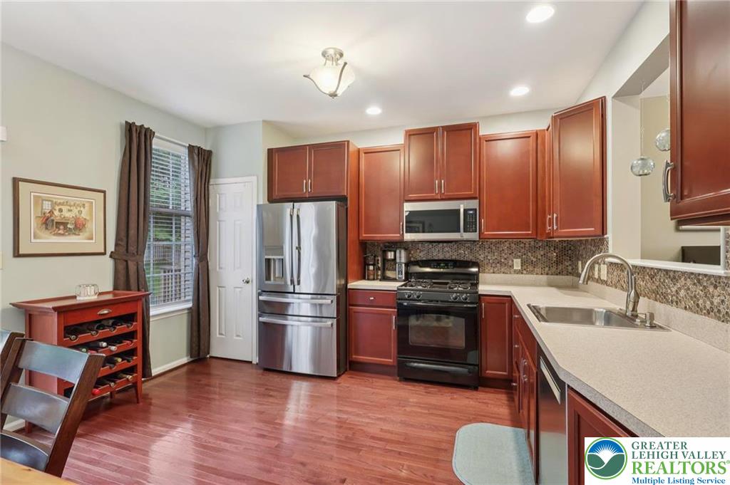 5192 Spring Ridge Drive East Macungie, PA 18062 - Photo 2 of 11 a kitchen with stainless steel appliances granite countertop a refrigerator stove and sink