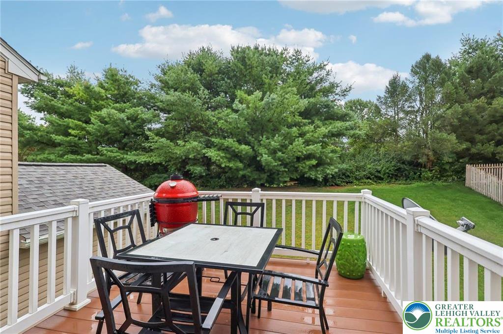 5192 Spring Ridge Drive East Macungie, PA 18062 - Photo 3 of 11 a balcony with wooden floor table and chairs