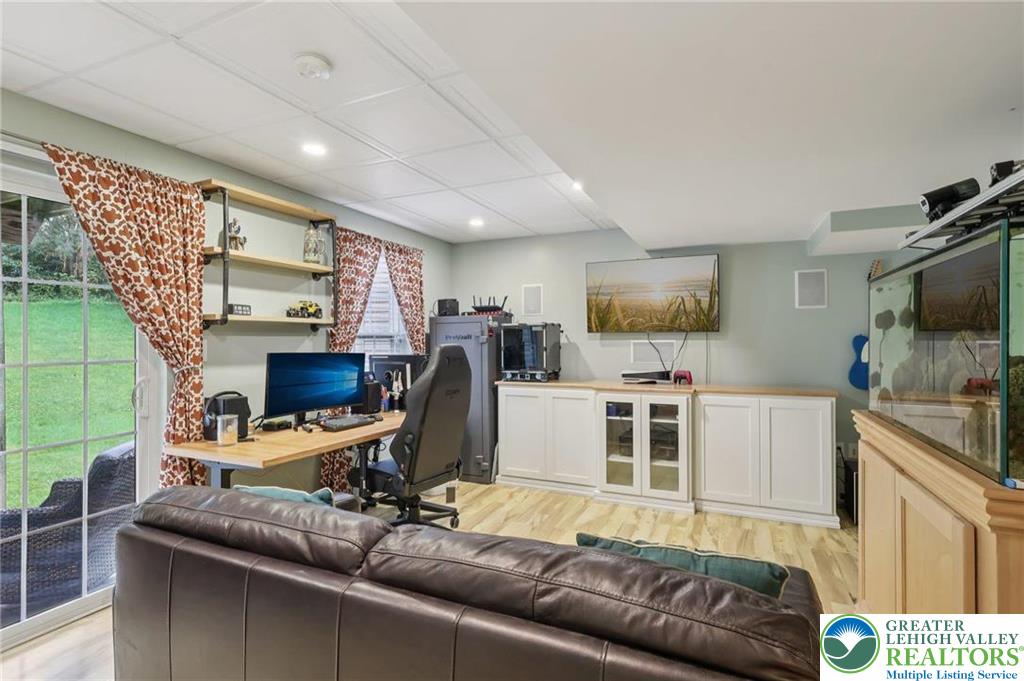 5192 Spring Ridge Drive East Macungie, PA 18062 - Photo 6 of 11 a living room with furniture and a flat screen tv