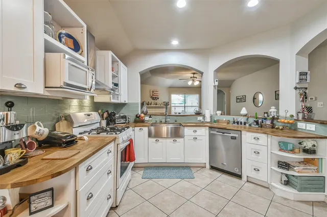 a kitchen with sink cabinets and window